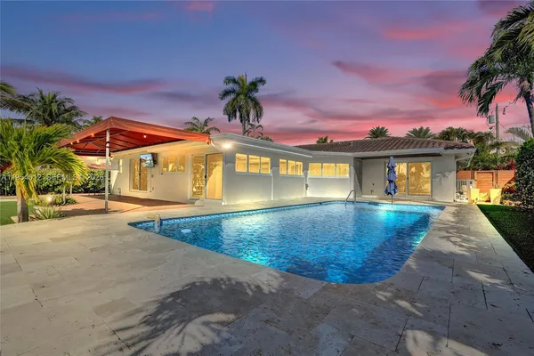 a view of a house with a swimming pool