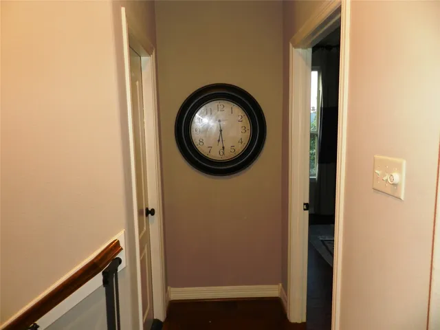 a view of small space with a door and a mirror