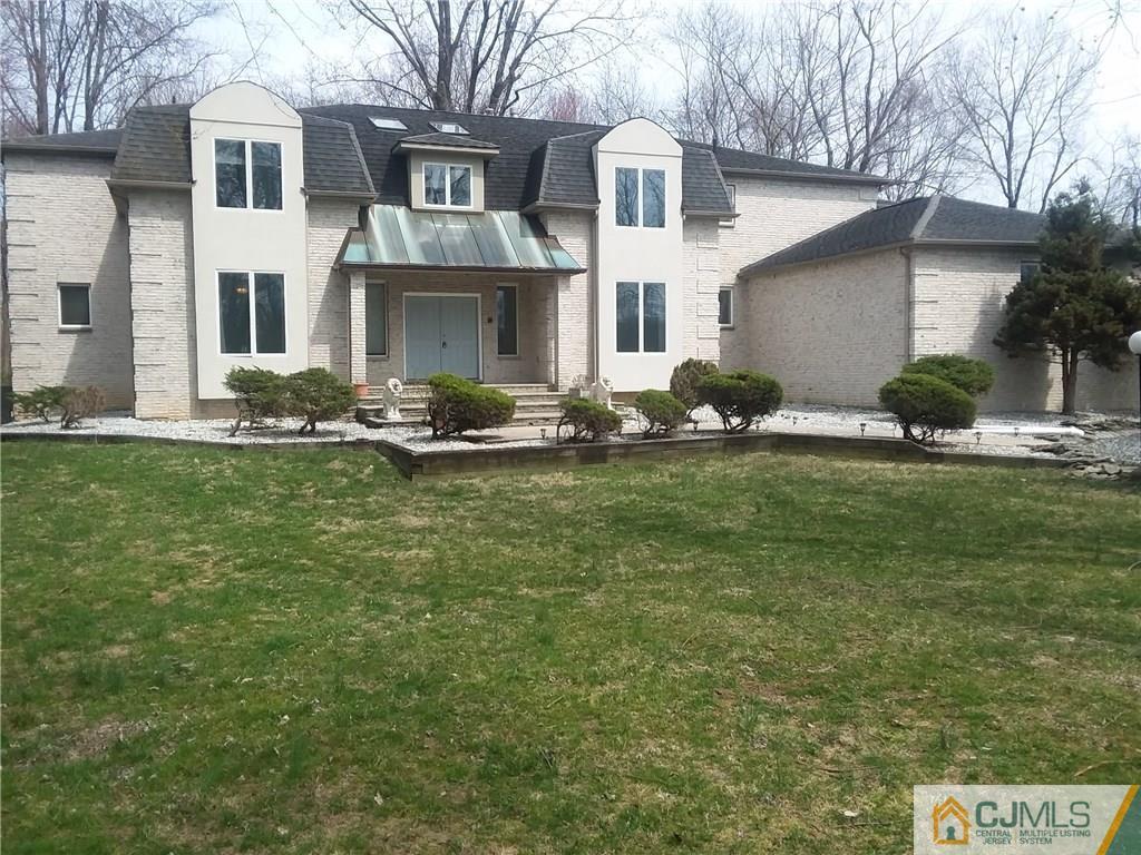 268 Friendship Road Monmouth Junction, NJ 08852 - Photo 2 of 24 a front view of a house with a yard