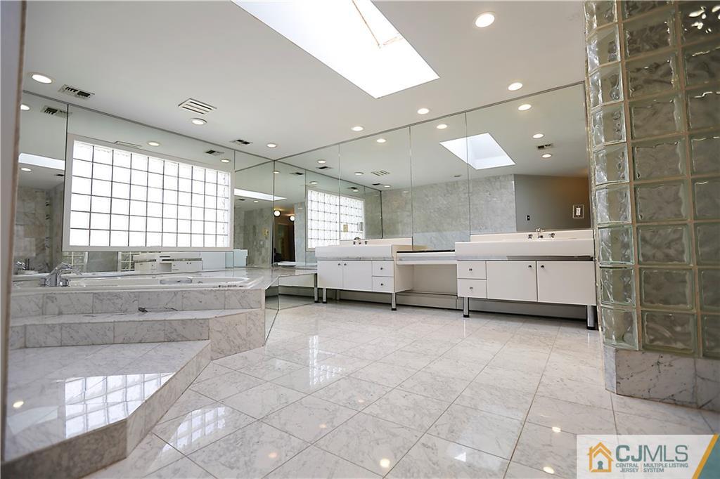268 Friendship Road Monmouth Junction, NJ 08852 - Photo 14 of 24 a bathroom with a double vanity sink mirror and bathtub