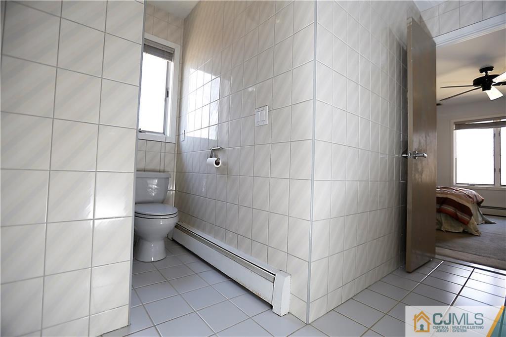268 Friendship Road Monmouth Junction, NJ 08852 - Photo 20 of 24 a bathroom with a toilet and a shower