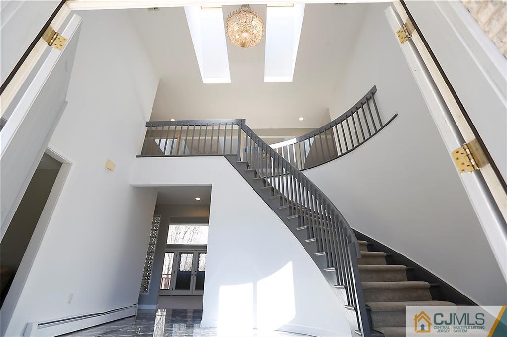 268 Friendship Road Monmouth Junction, NJ 08852 - Photo 3 of 24 a view of entryway and hall with wooden floor