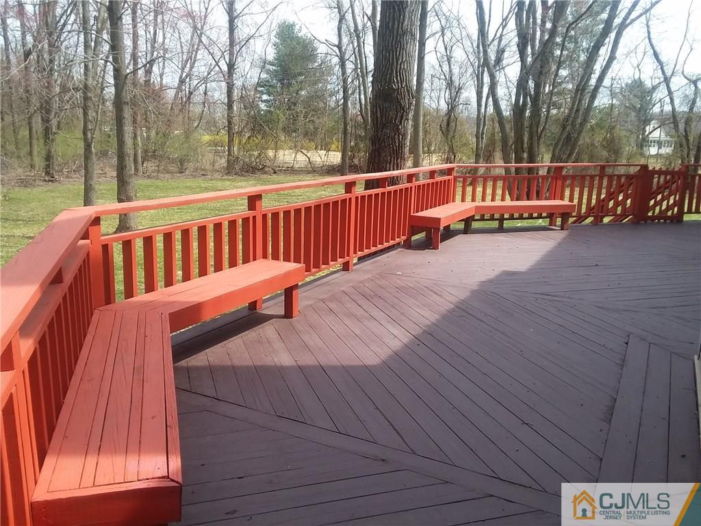 268 Friendship Road Monmouth Junction, NJ 08852 - Photo 21 of 24 a view of a wooden deck with trees in the background