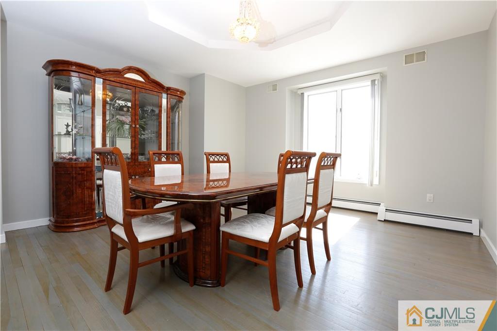 268 Friendship Road Monmouth Junction, NJ 08852 - Photo 6 of 24 a dining room with furniture and wooden floor