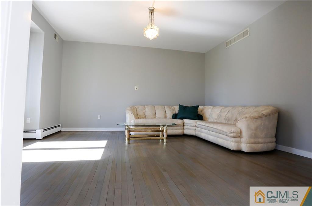 268 Friendship Road Monmouth Junction, NJ 08852 - Photo 7 of 24 a living room with furniture and a couch