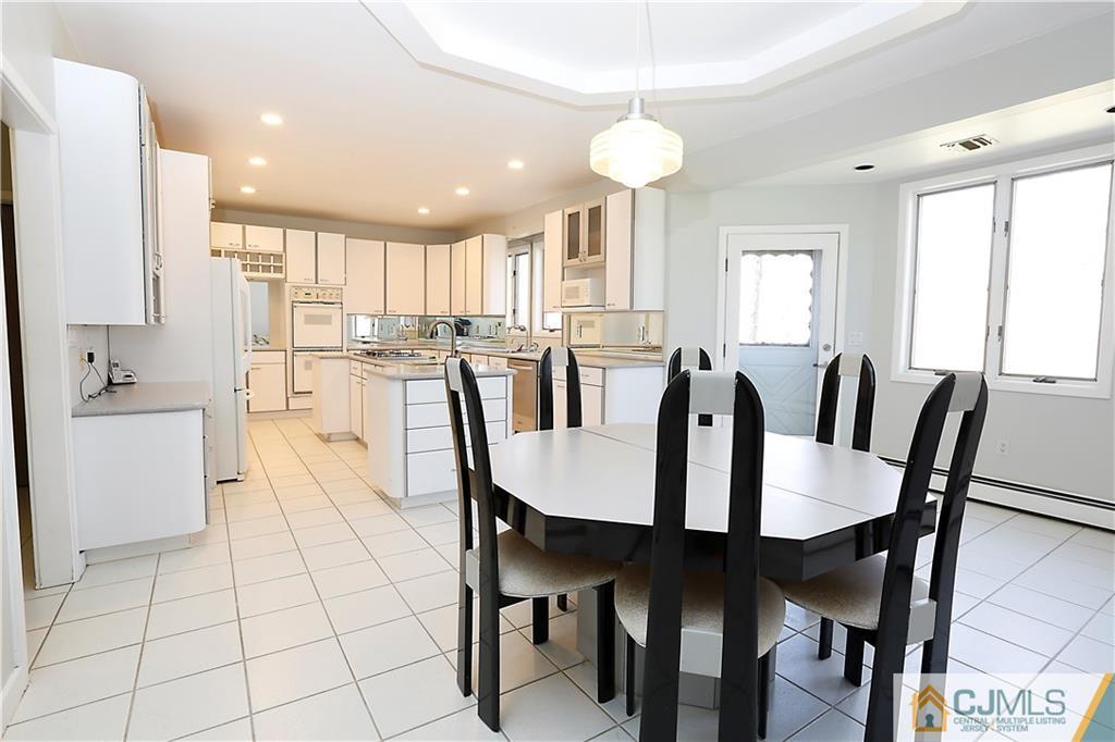 268 Friendship Road Monmouth Junction, NJ 08852 - Photo 8 of 24 a view of a dining room with furniture and a chandelier