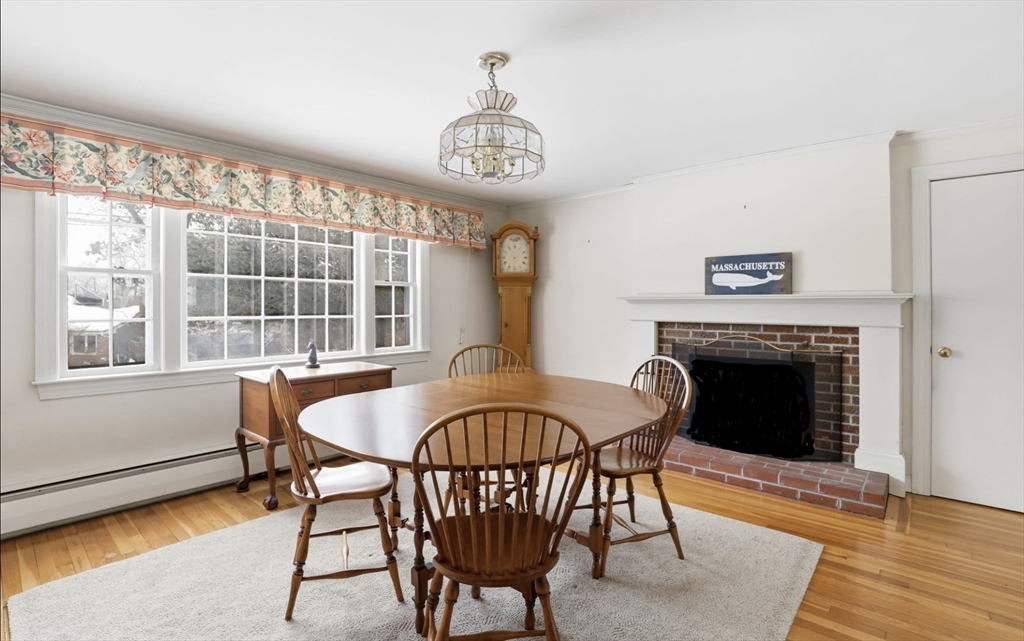 49 Jackson Road Scituate, MA 02066 - Photo 11 of 25 a view of a dining room with furniture window and wooden floor