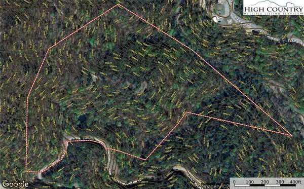 a backyard of a house with lots of trees