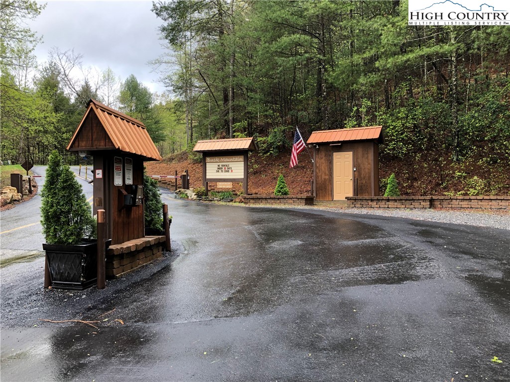 Lot 218 Casey Mountain Road Purlear, NC 28665 - Photo 24 of 48 a front view of a house with a yard