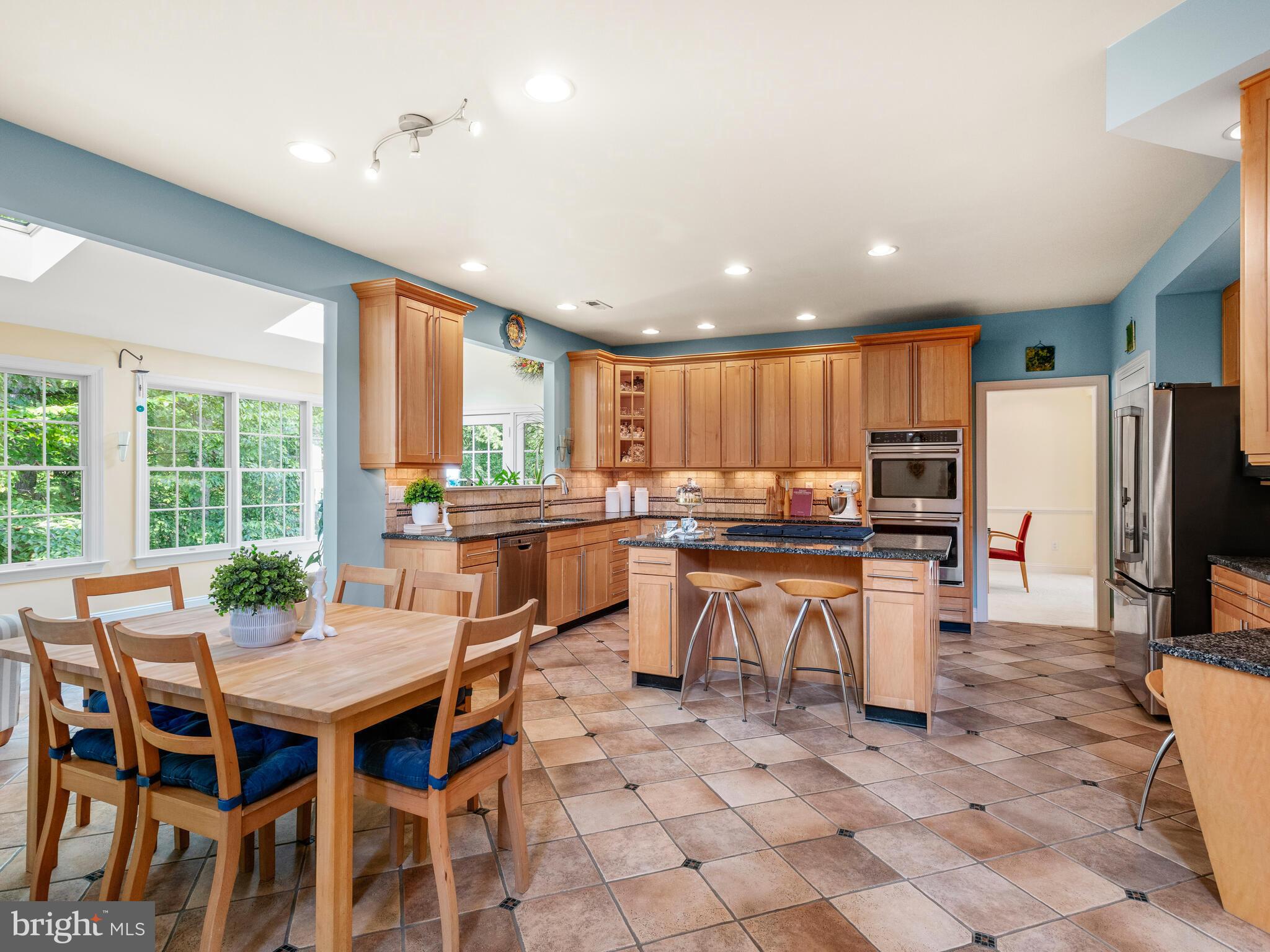452 Springview Lane Phoenixville, PA 19460 - Photo 16 of 74 a kitchen with a table and chairs in it