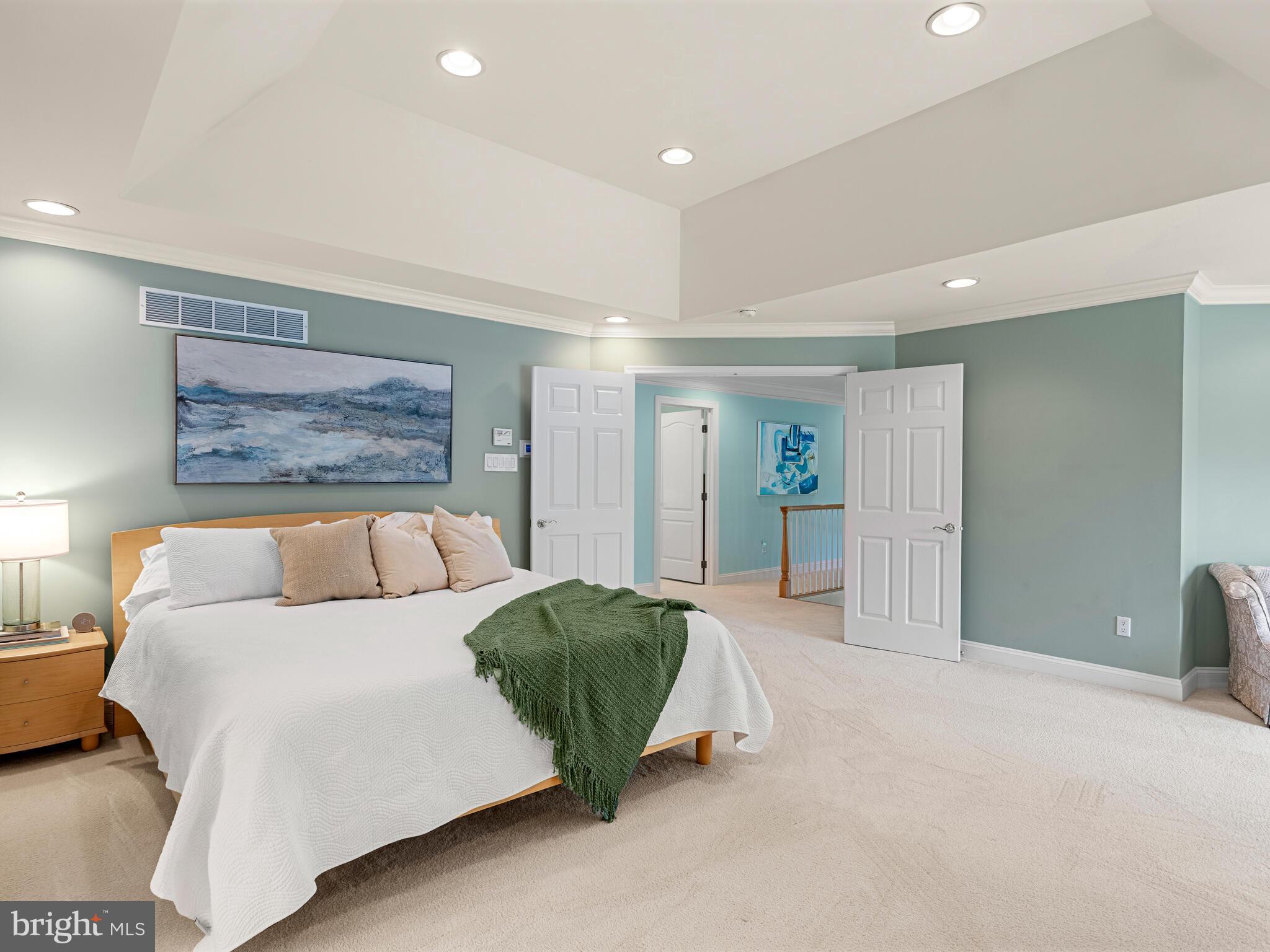 452 Springview Lane Phoenixville, PA 19460 - Photo 36 of 74 a spacious bedroom with a large bed and a painting