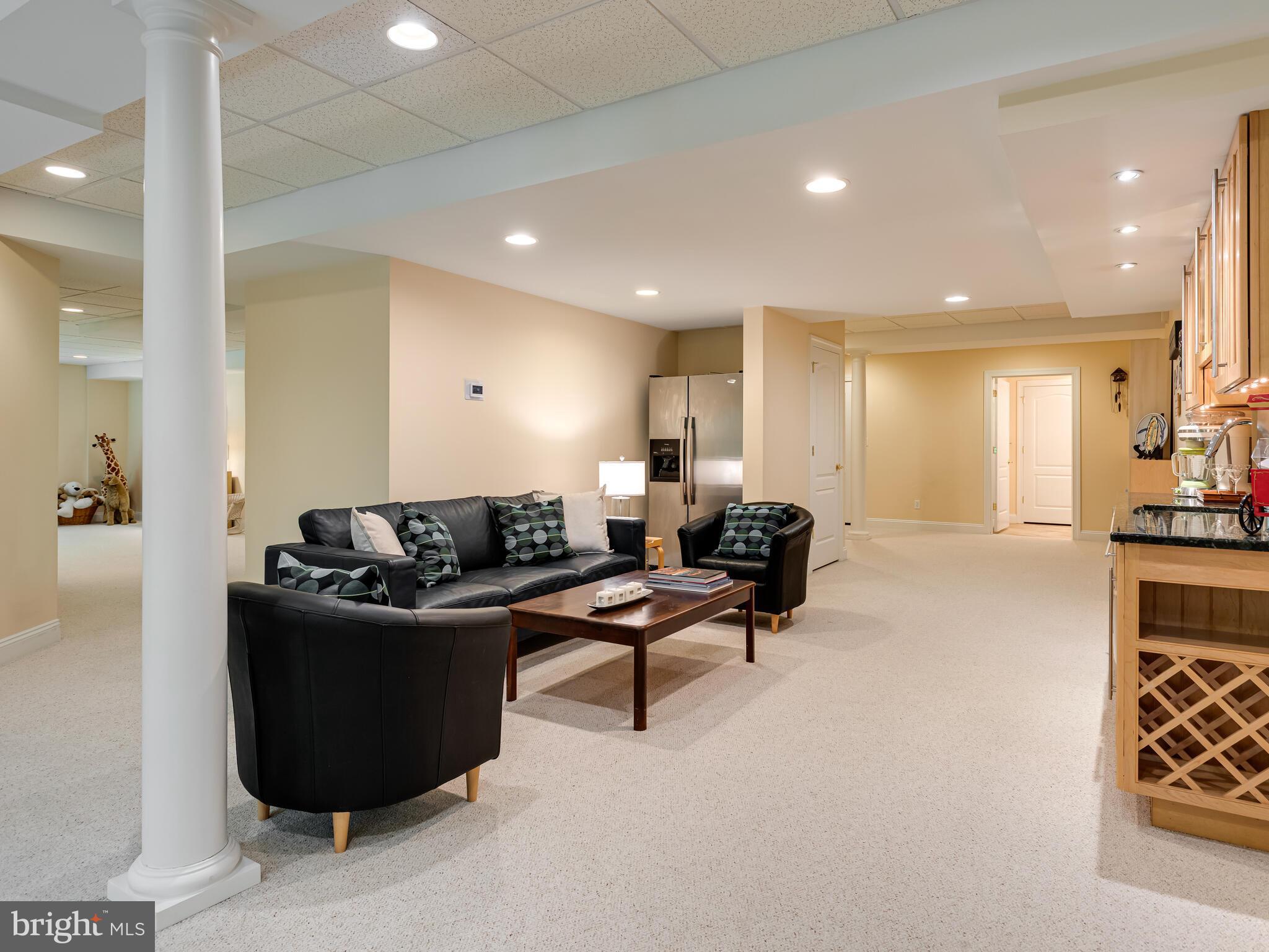 452 Springview Lane Phoenixville, PA 19460 - Photo 60 of 74 a living room with furniture a couch and a view of kitchen