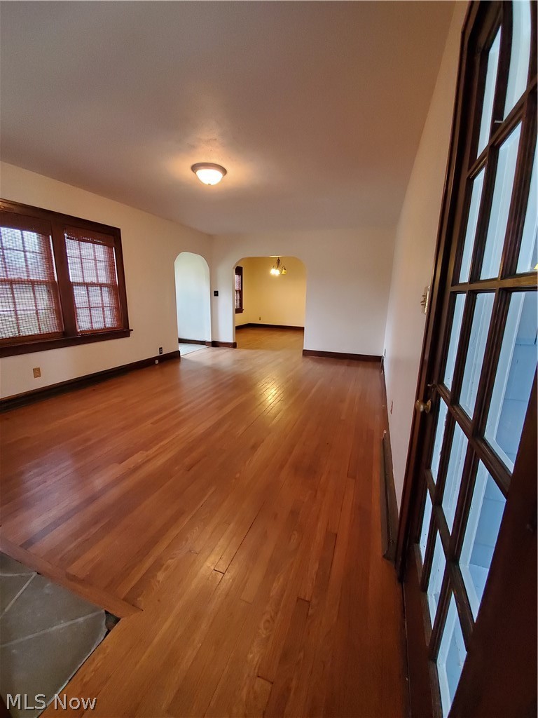 2129 Hubbard Road Madison, OH 44057 - Photo 5 of 27 View from sunroom through living room and into dining room with awesome wood floors!