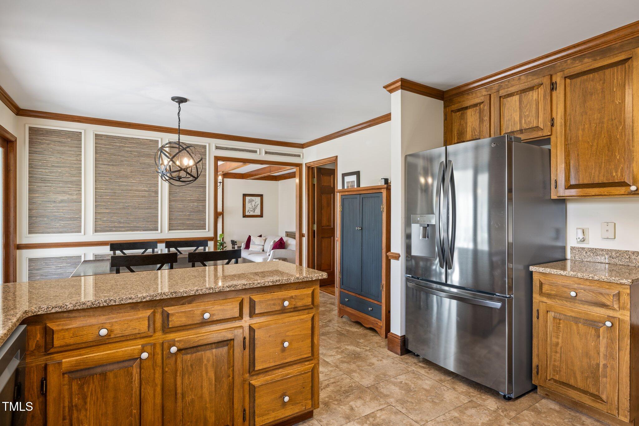 7205 Penny Road Raleigh, NC 27606 - Photo 13 of 50 a kitchen with stainless steel appliances granite countertop a refrigerator and a sink