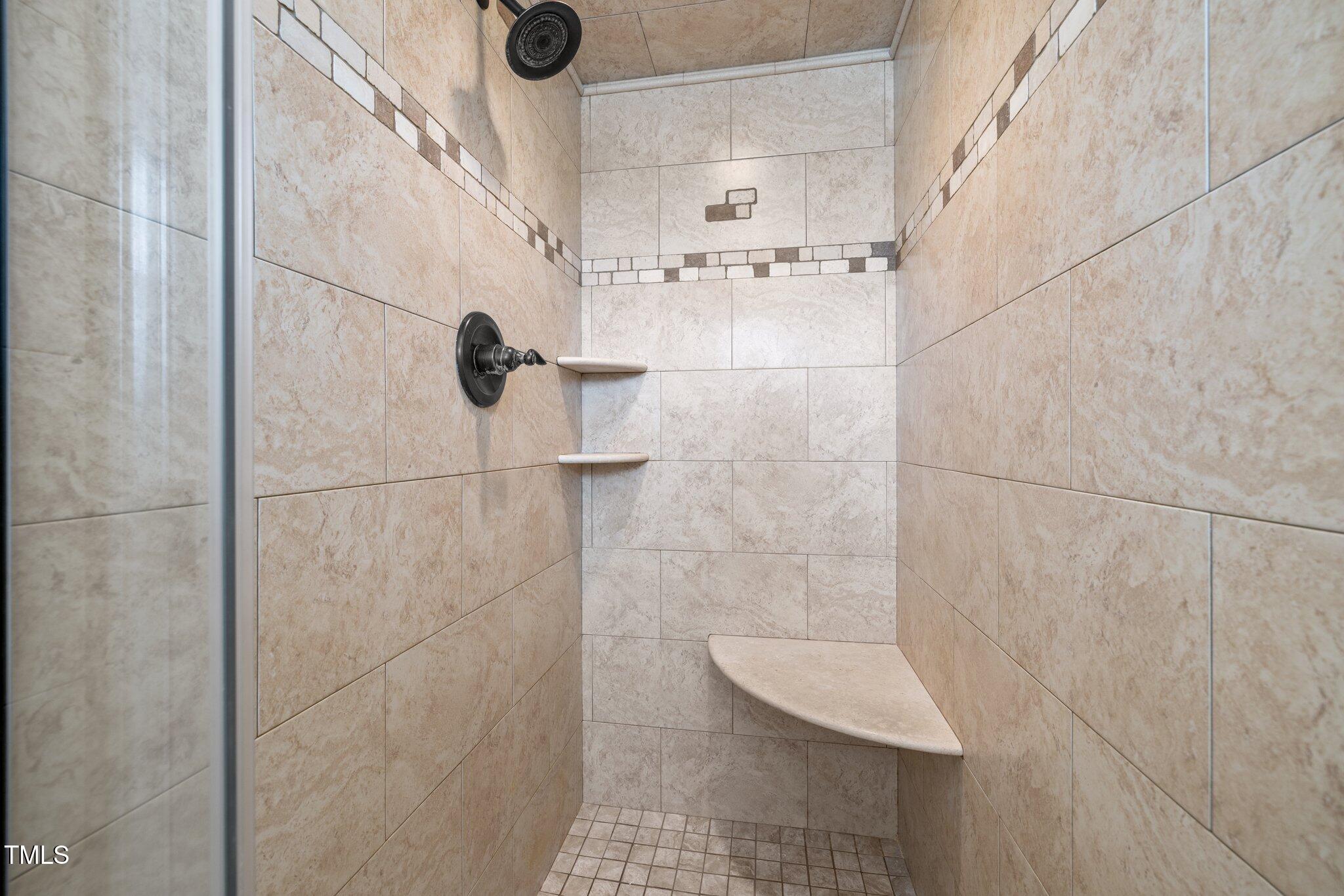 7205 Penny Road Raleigh, NC 27606 - Photo 19 of 50 a bathroom with a shower