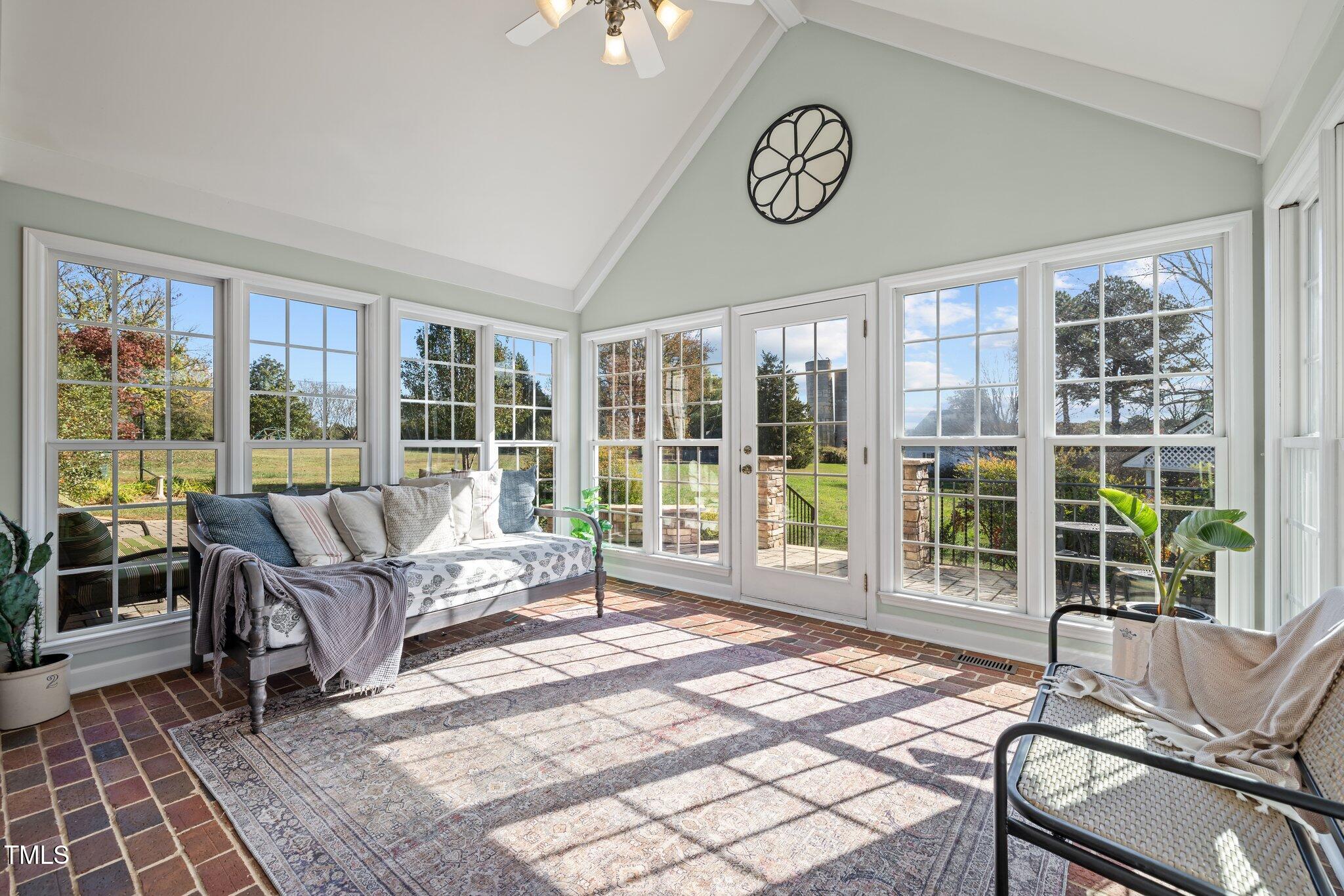 7205 Penny Road Raleigh, NC 27606 - Photo 29 of 50 a living room with furniture and large windows