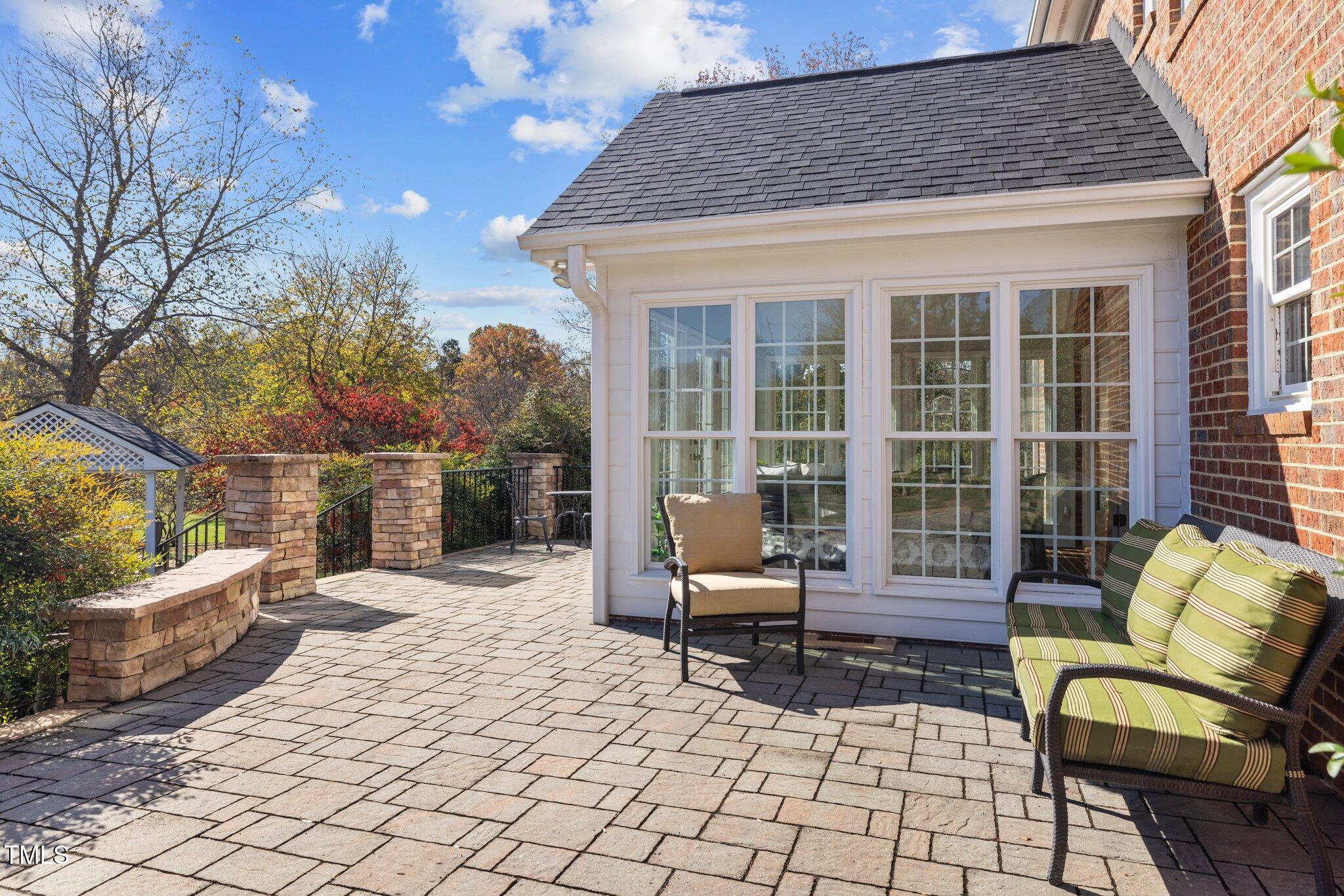 7205 Penny Road Raleigh, NC 27606 - Photo 31 of 50 a building outdoor space with patio furniture and potted plants