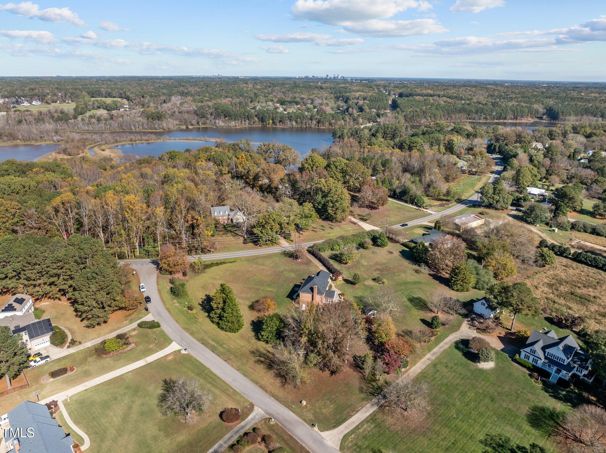 7205 Penny Road Raleigh, NC 27606 - Photo 49 of 50 an aerial view of a house with a lake view