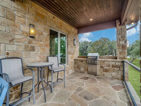 a outdoor dining space with furniture and outdoor view