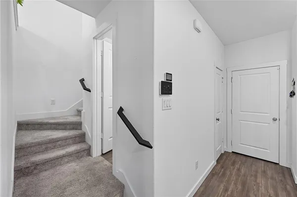 a view of entryway with stairs and wooden floor