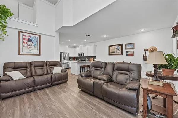 a living room with furniture and a lamp