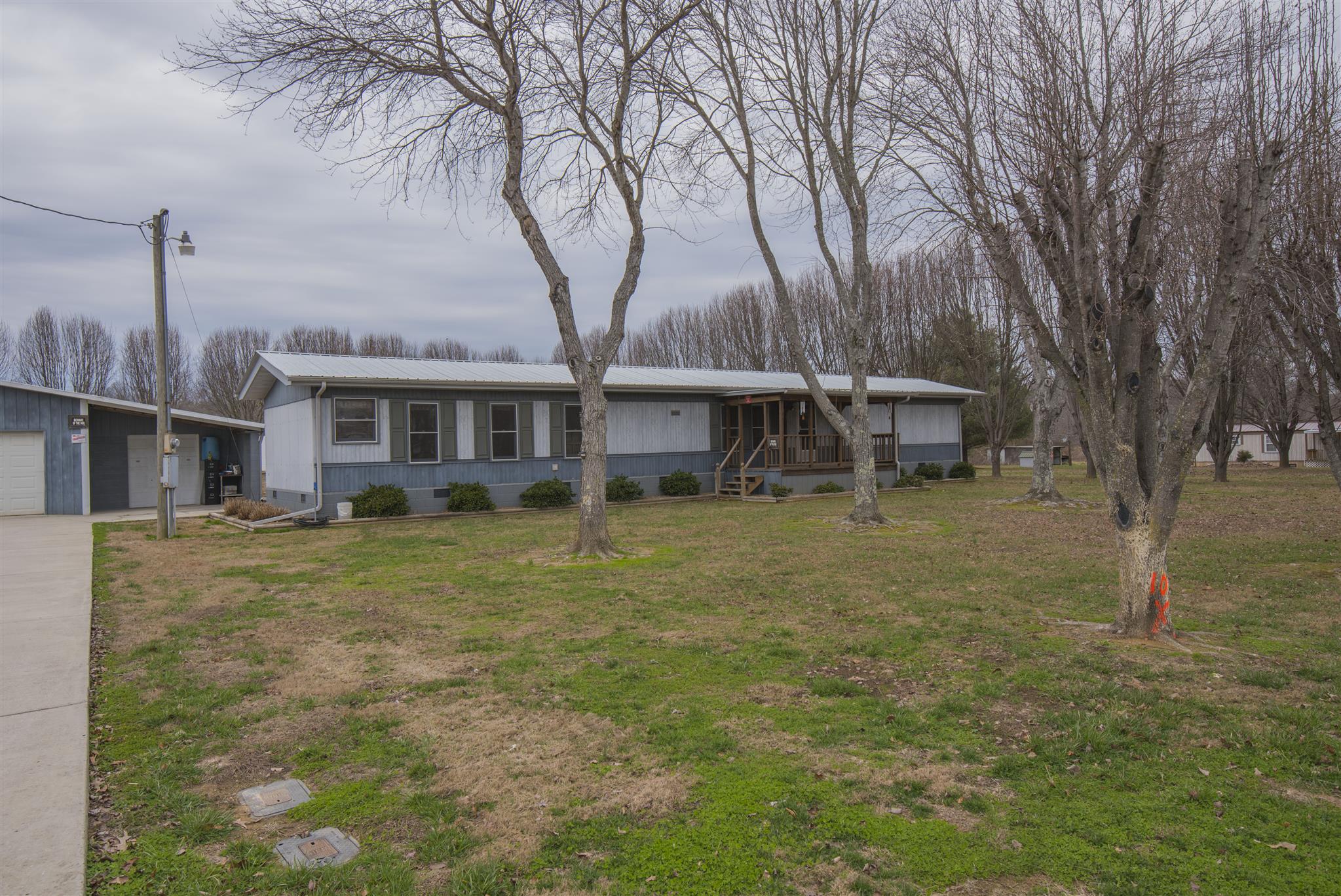 123 Norris Perry Road Manchester, TN 37355 - Photo 1 of 23 a view of a house with a yard
