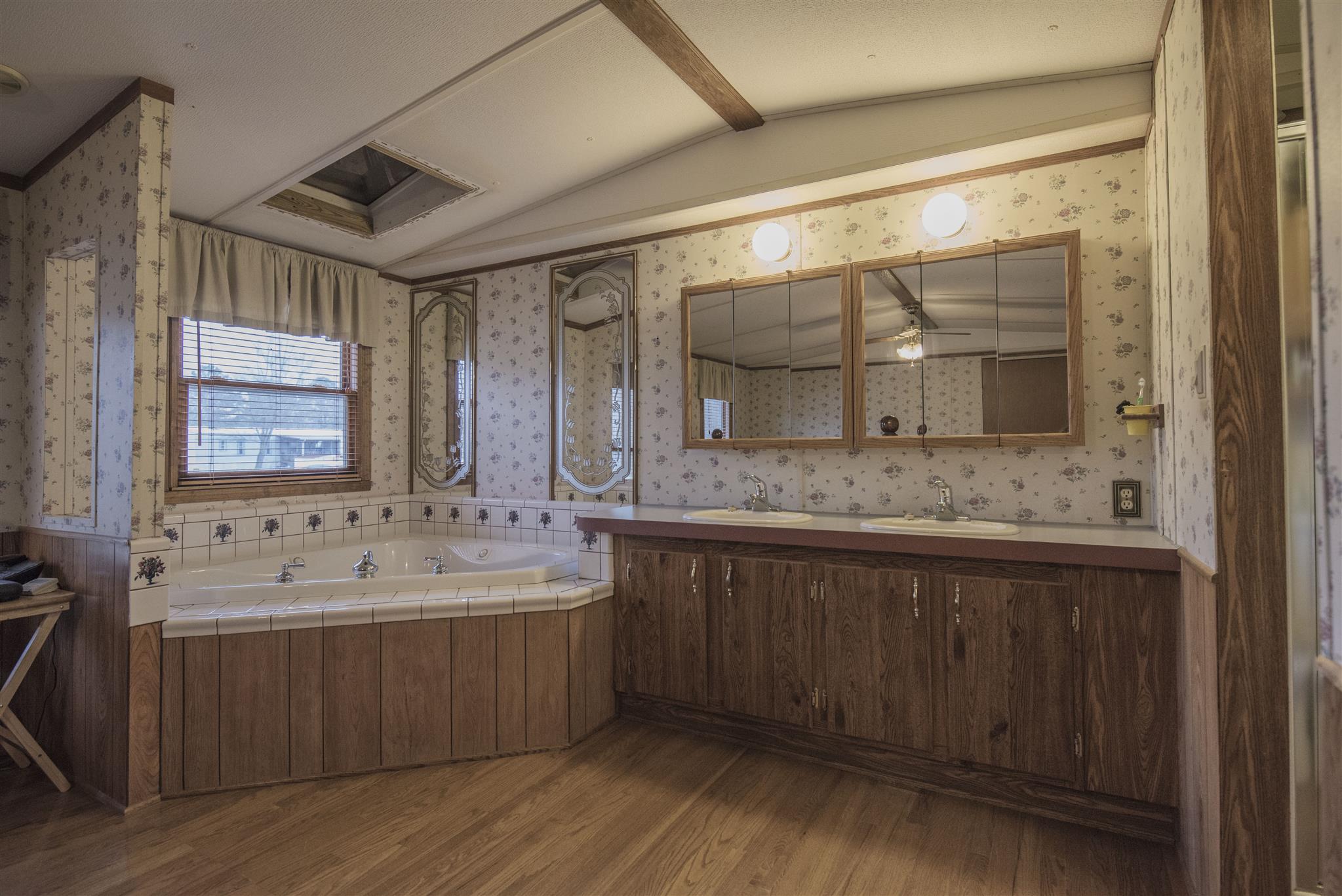 123 Norris Perry Road Manchester, TN 37355 - Photo 12 of 23 a bathroom with a double vanity sink mirror and double
