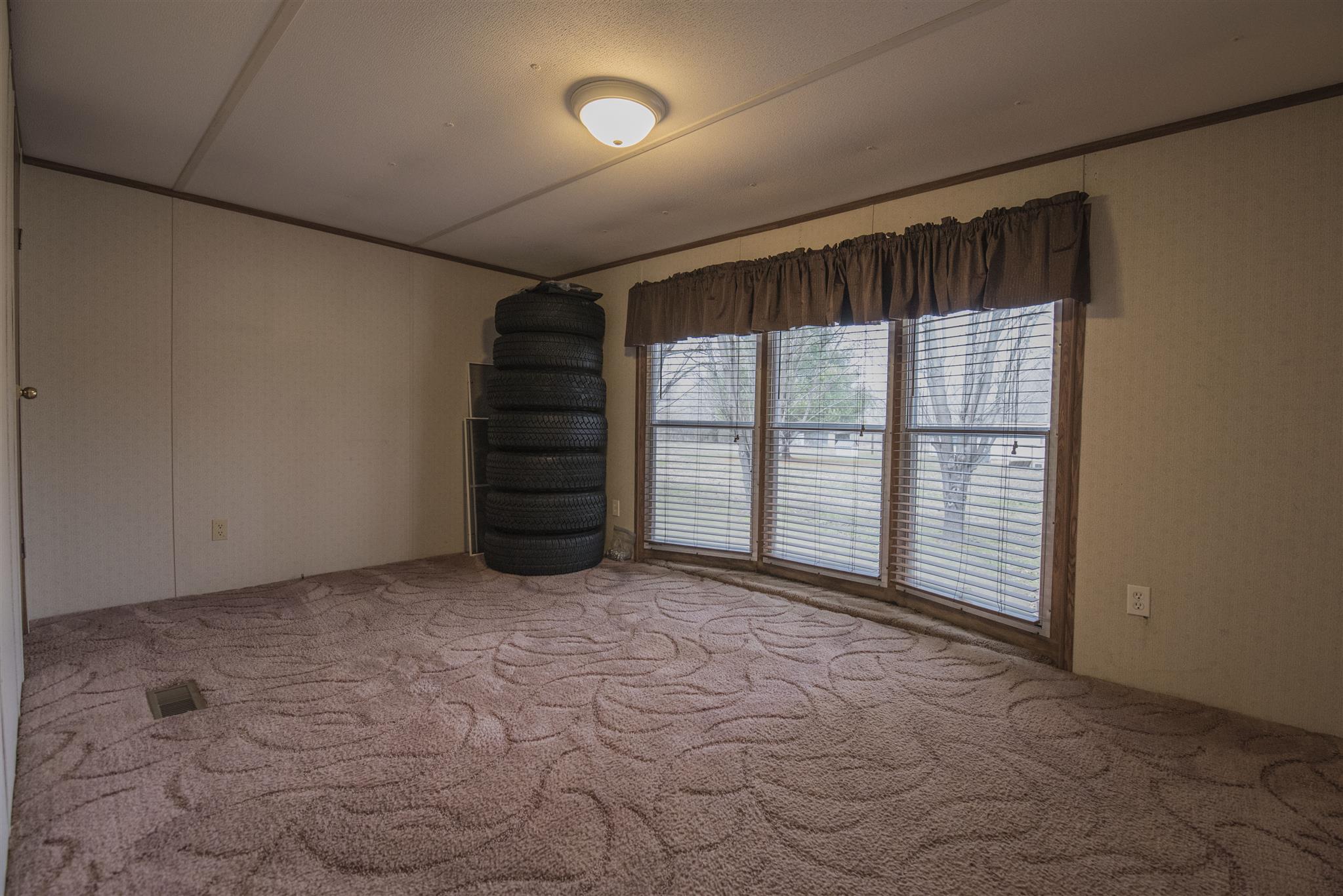 123 Norris Perry Road Manchester, TN 37355 - Photo 15 of 23 a view of an empty room with a window