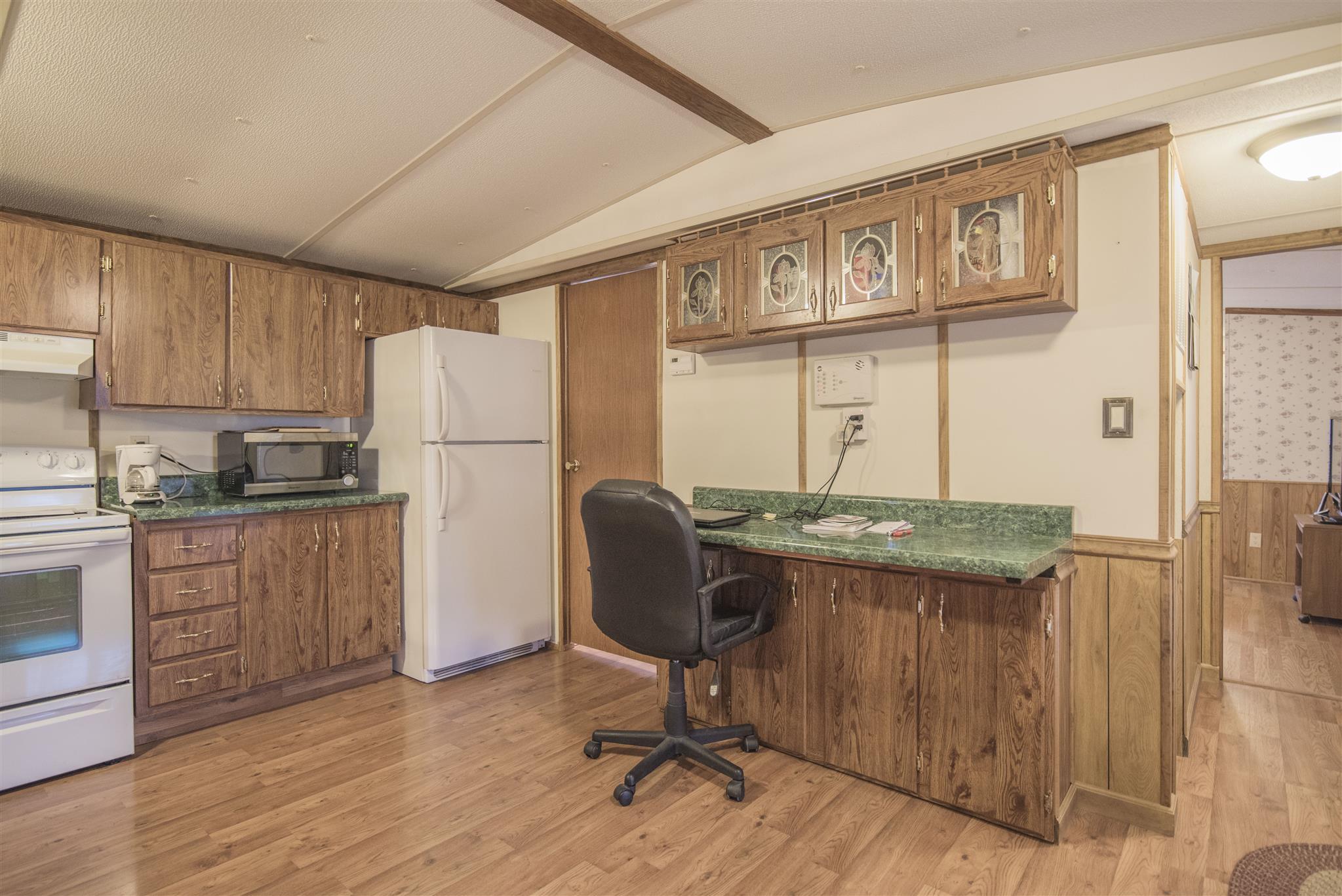 123 Norris Perry Road Manchester, TN 37355 - Photo 6 of 23 a kitchen with stainless steel appliances granite countertop a refrigerator and a stove top oven