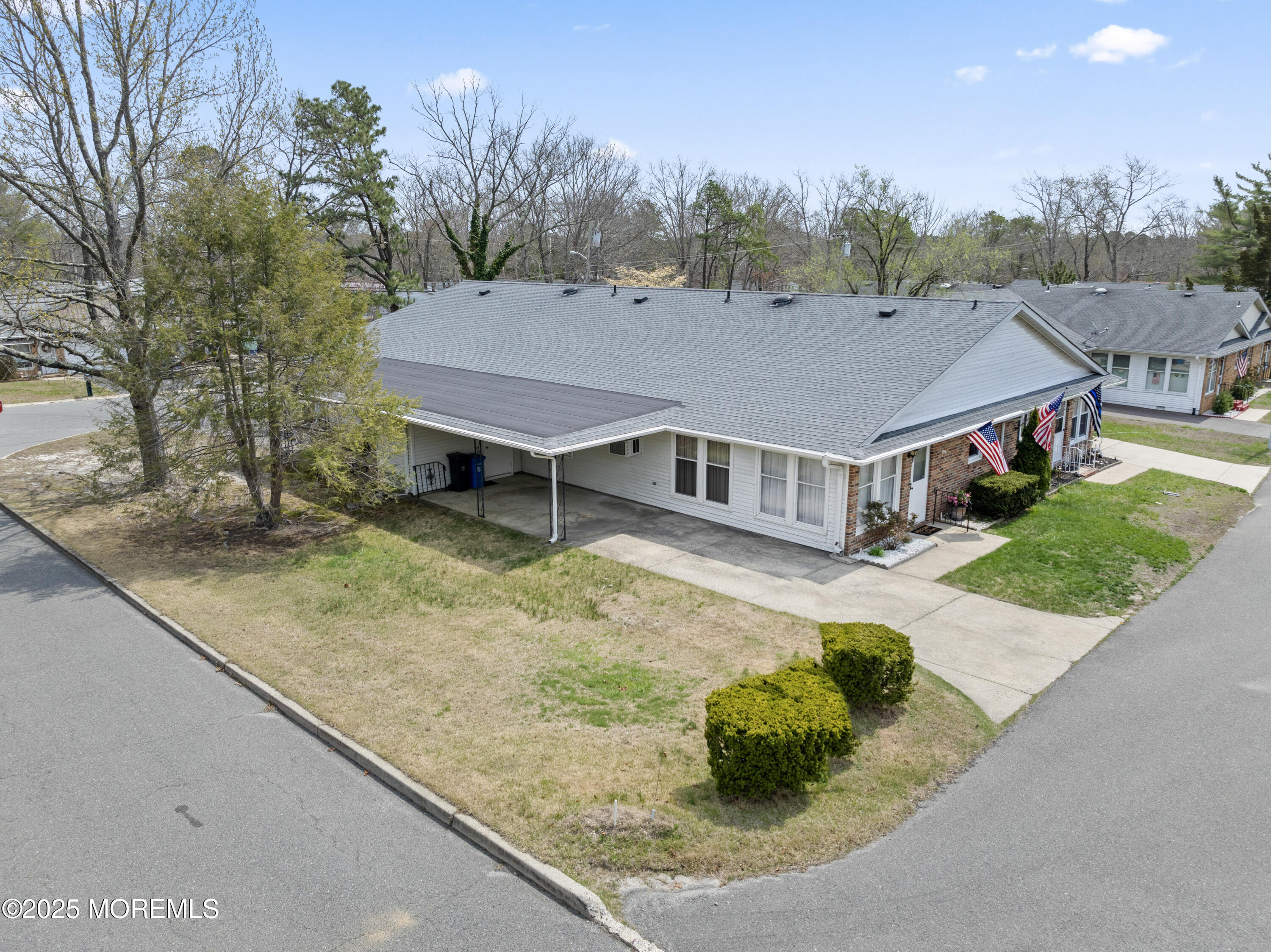 20 Sycamore Road, Unit D Manahawkin, NJ 08050 - Photo 1 of 19 a view of a house with a yard and sitting area