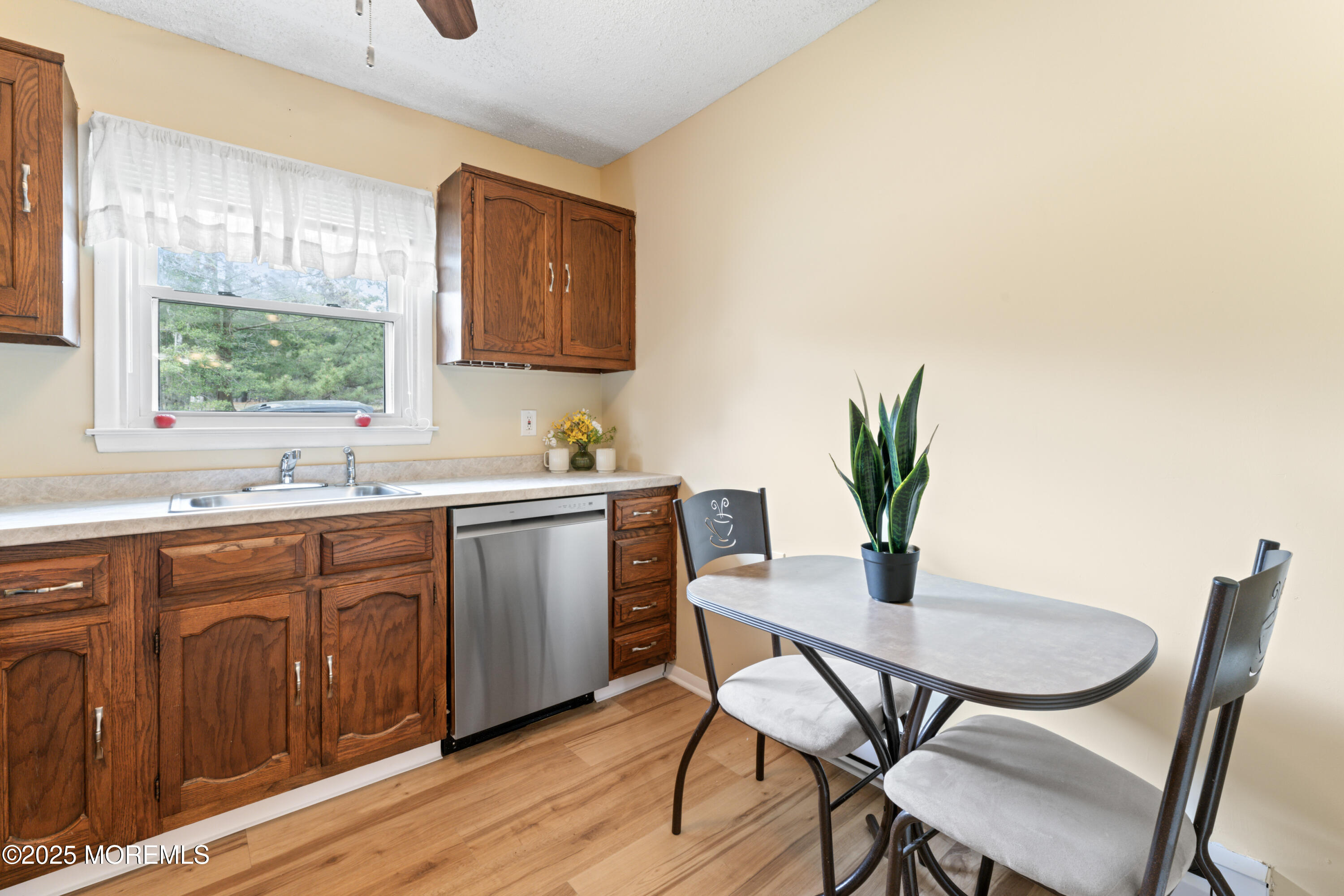 20 Sycamore Road, Unit D Manahawkin, NJ 08050 - Photo 12 of 19 a kitchen with a table and chairs in it
