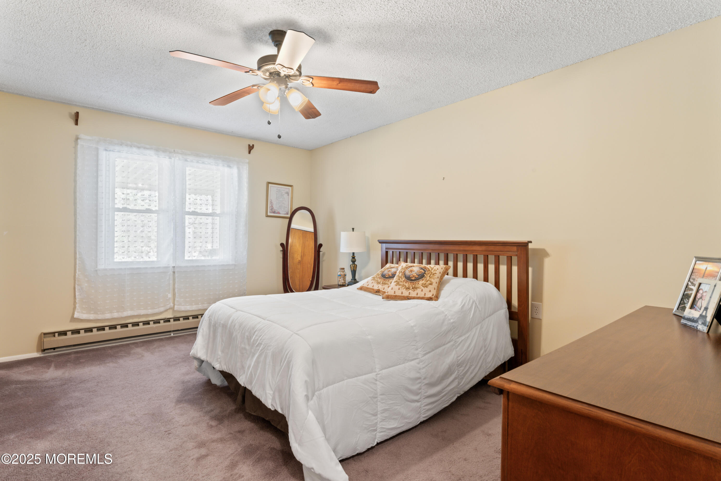 20 Sycamore Road, Unit D Manahawkin, NJ 08050 - Photo 13 of 19 a bedroom with a bed and window