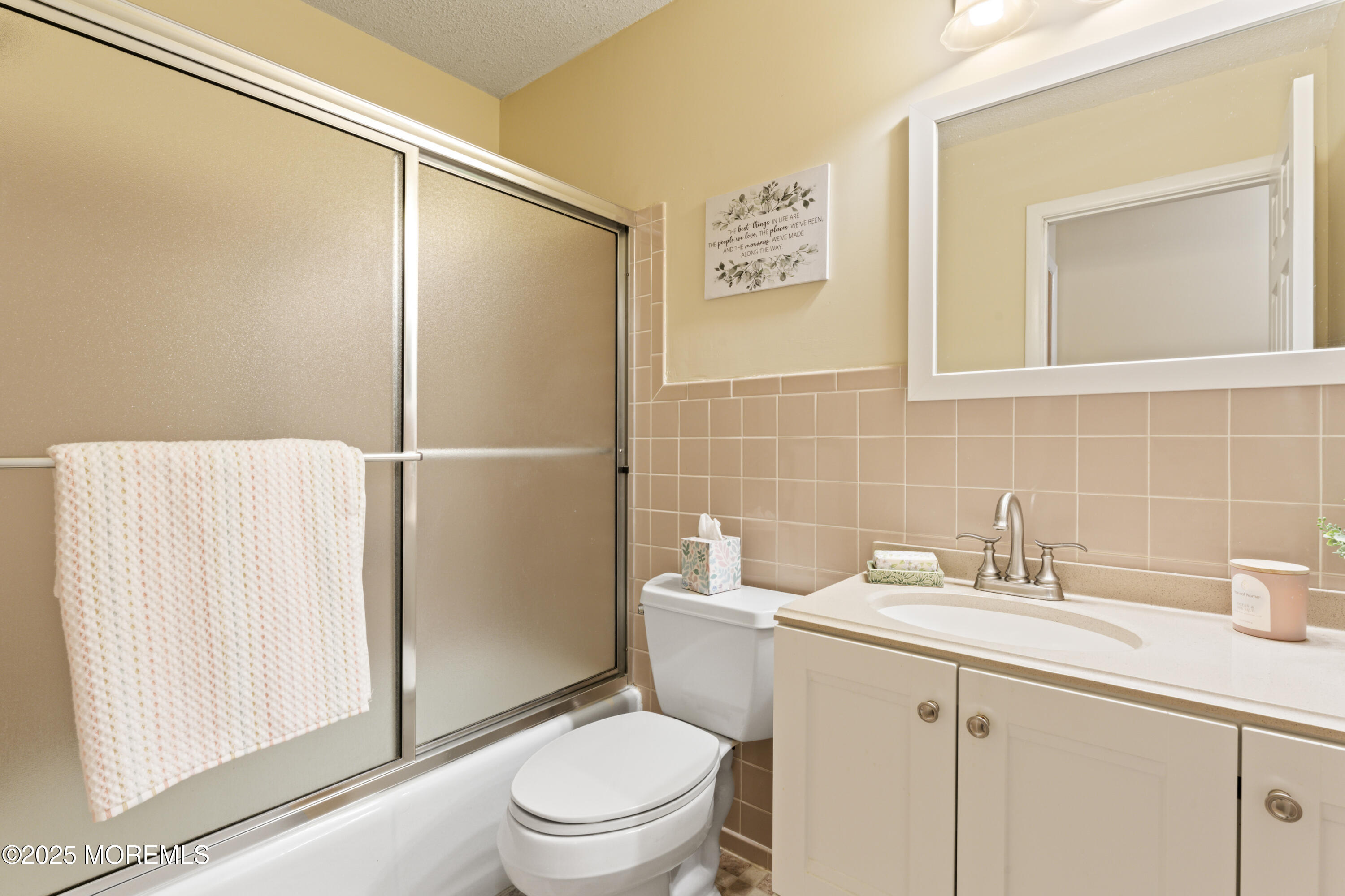 20 Sycamore Road, Unit D Manahawkin, NJ 08050 - Photo 15 of 19 a bathroom with a sink a toilet and shower
