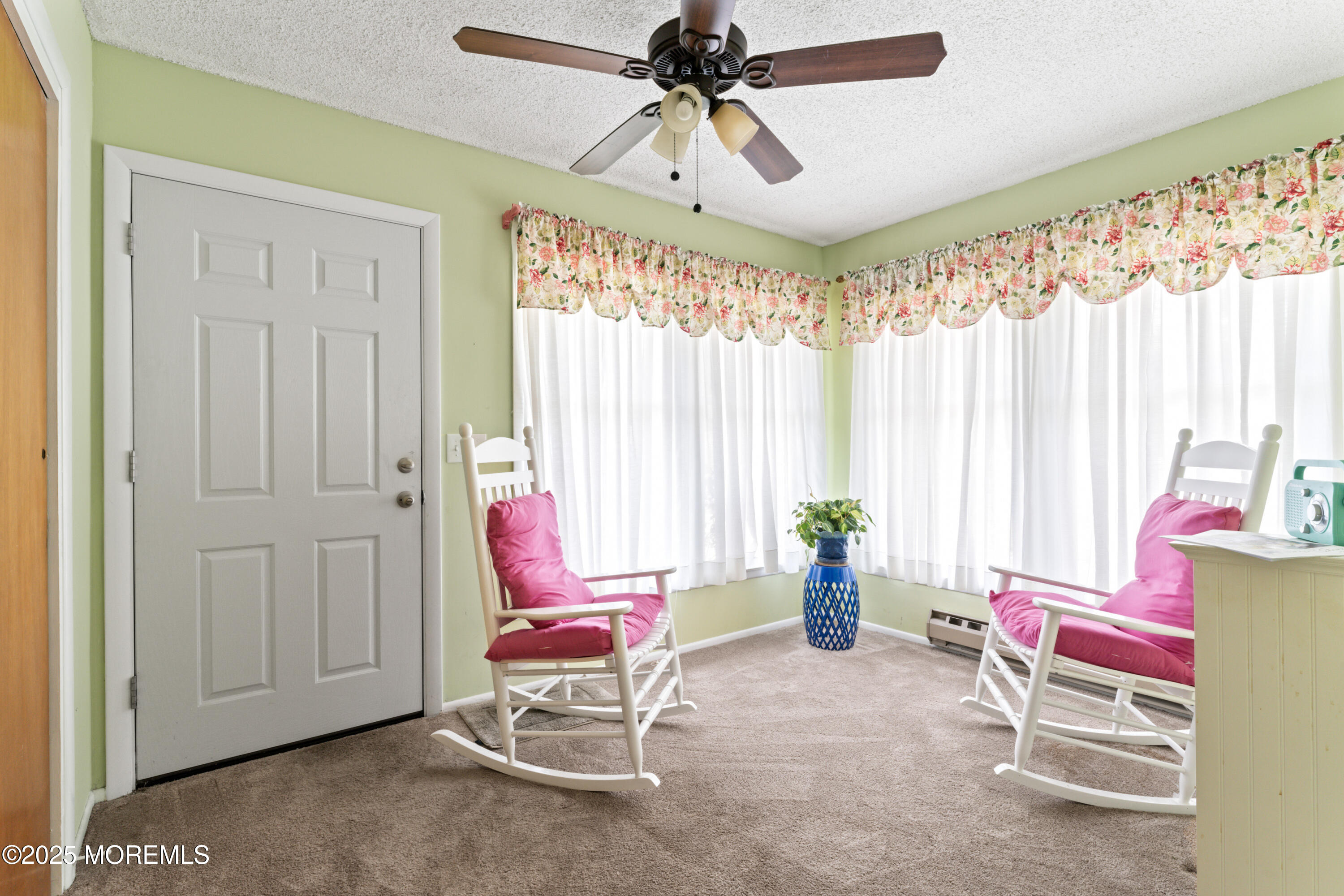 20 Sycamore Road, Unit D Manahawkin, NJ 08050 - Photo 5 of 19 a living room with furniture and a chandelier