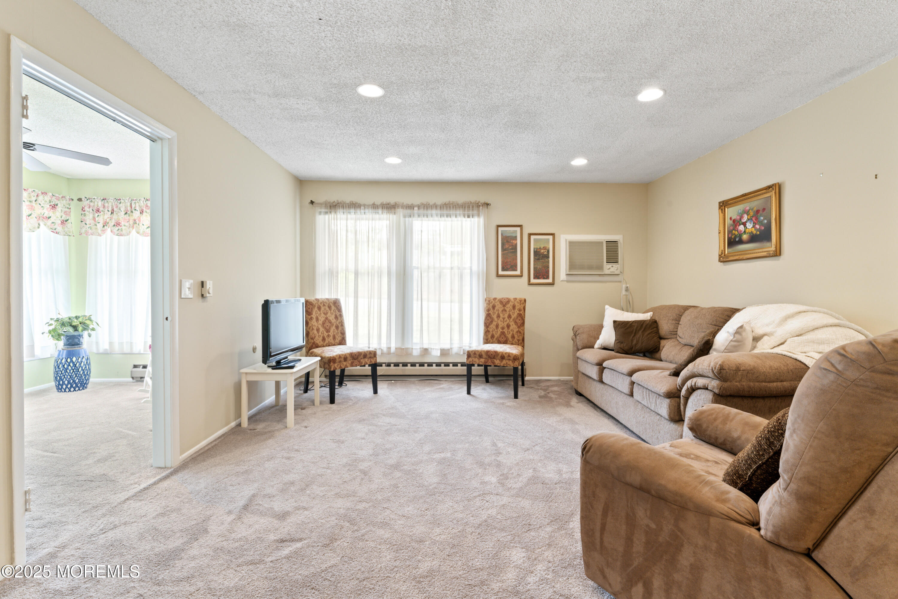20 Sycamore Road, Unit D Manahawkin, NJ 08050 - Photo 6 of 19 a living room with furniture and a large window