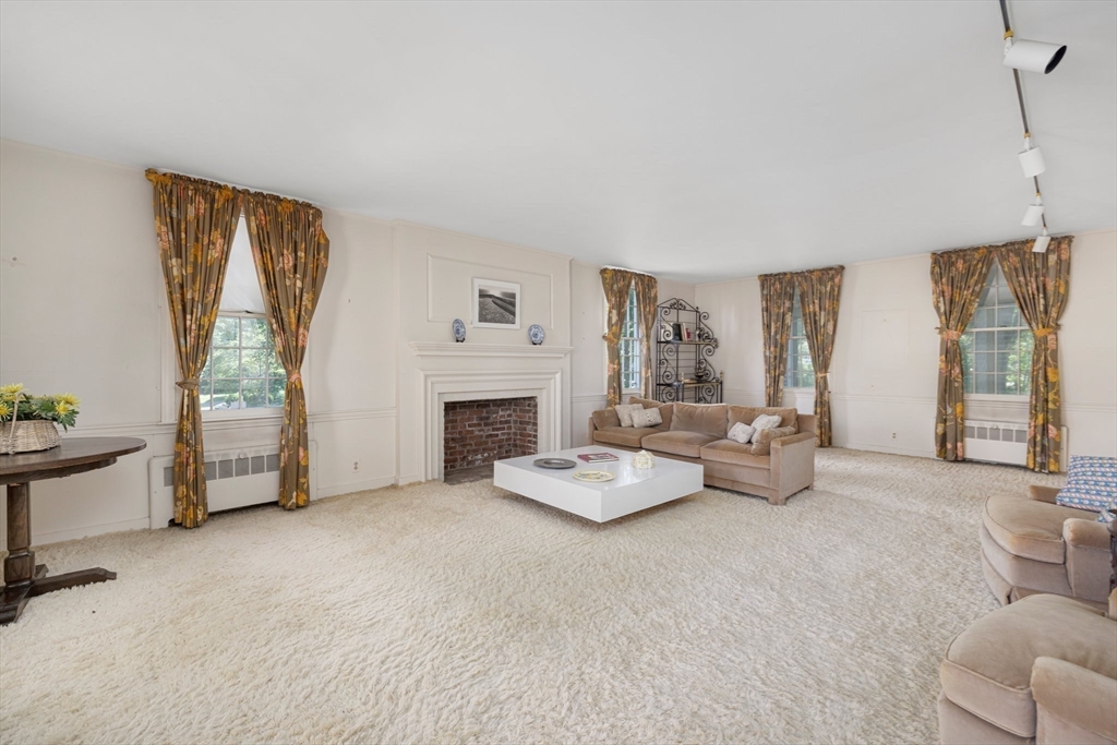 200 Highcrest Road Fall River, MA 02720 - Photo 13 of 27 a living room with furniture and a fireplace