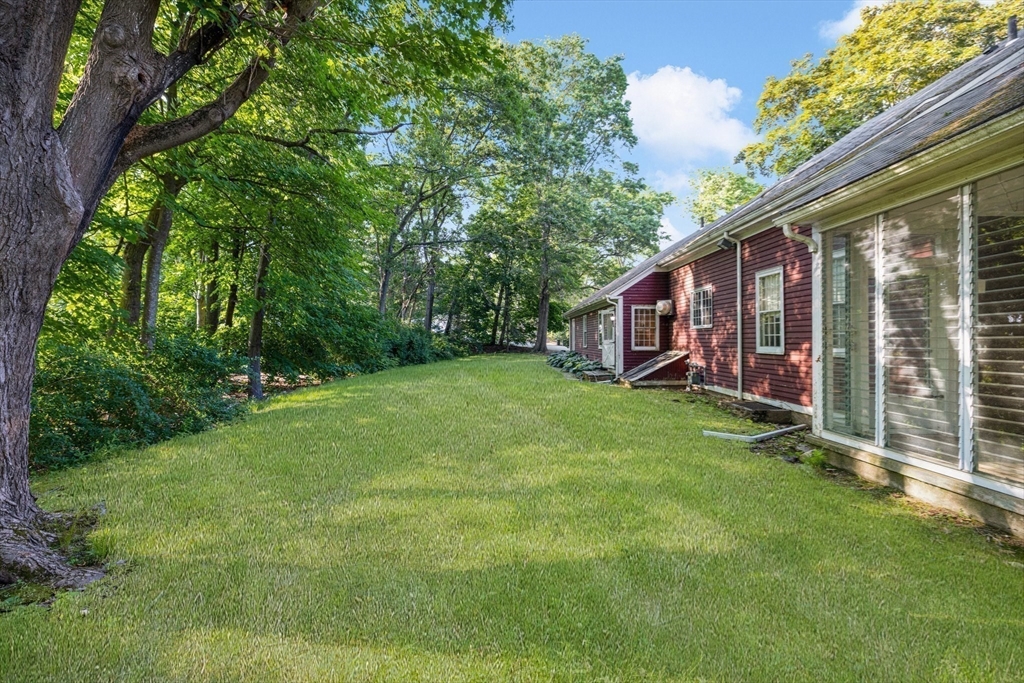 200 Highcrest Road Fall River, MA 02720 - Photo 4 of 27 a view of a house with a backyard and a patio