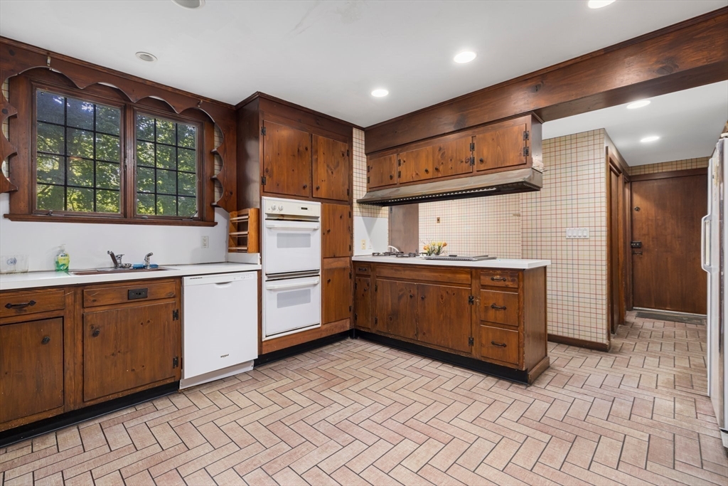 200 Highcrest Road Fall River, MA 02720 - Photo 6 of 27 a kitchen with granite countertop a sink cabinets and stainless steel appliances