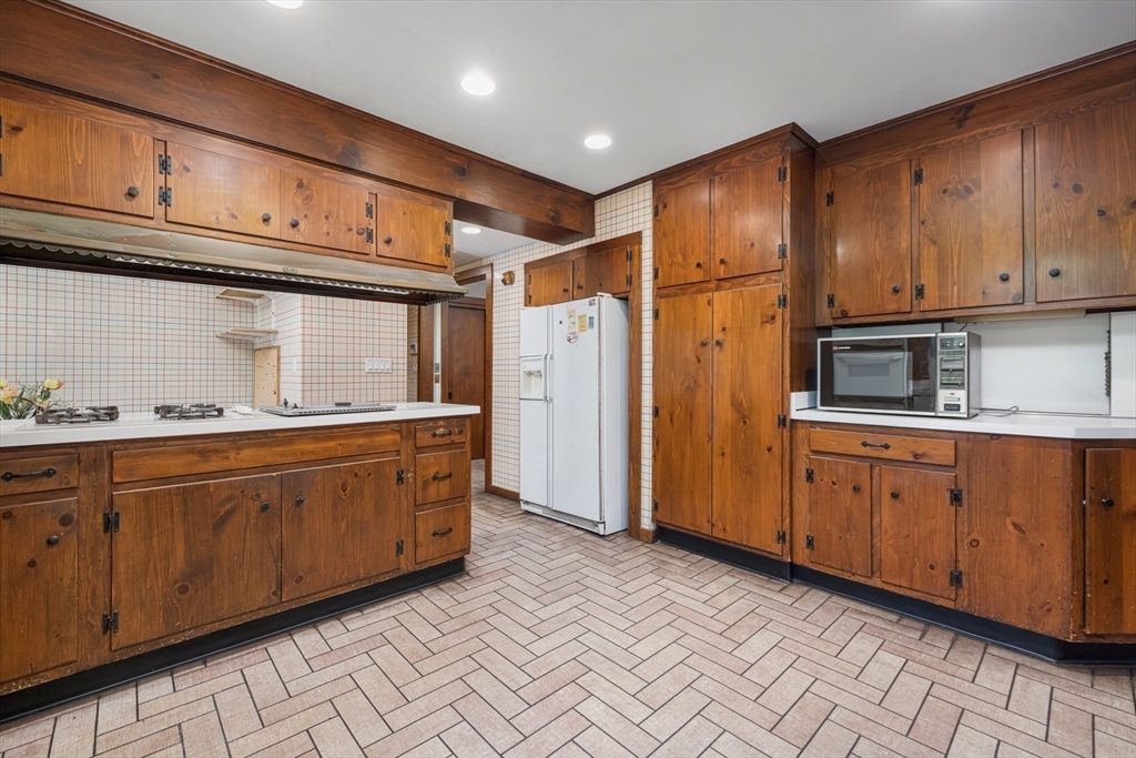 200 Highcrest Road Fall River, MA 02720 - Photo 7 of 27 a kitchen with stainless steel appliances granite countertop a refrigerator and cabinets