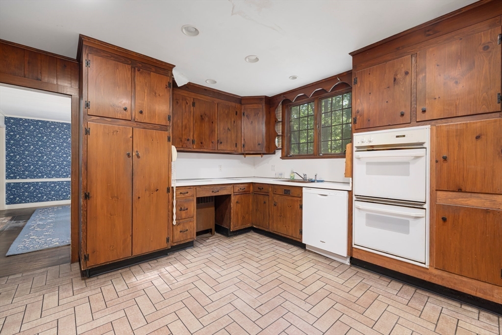 200 Highcrest Road Fall River, MA 02720 - Photo 8 of 27 a kitchen with a refrigerator a stove top oven and cabinets