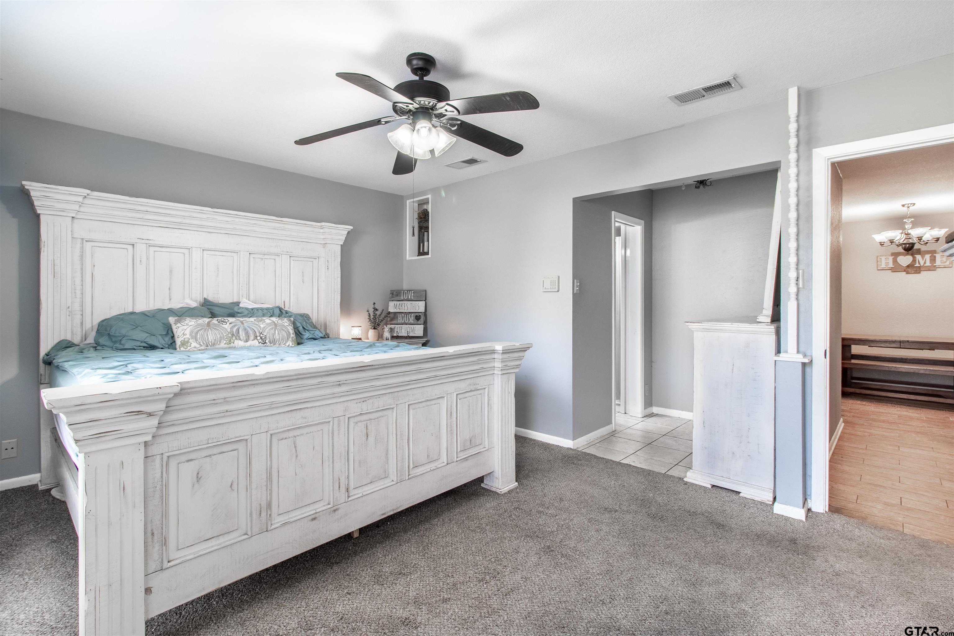727 Oxford Drive Tyler, TX 75703 - Photo 15 of 33 a bathroom with a double vanity sink and a mirror