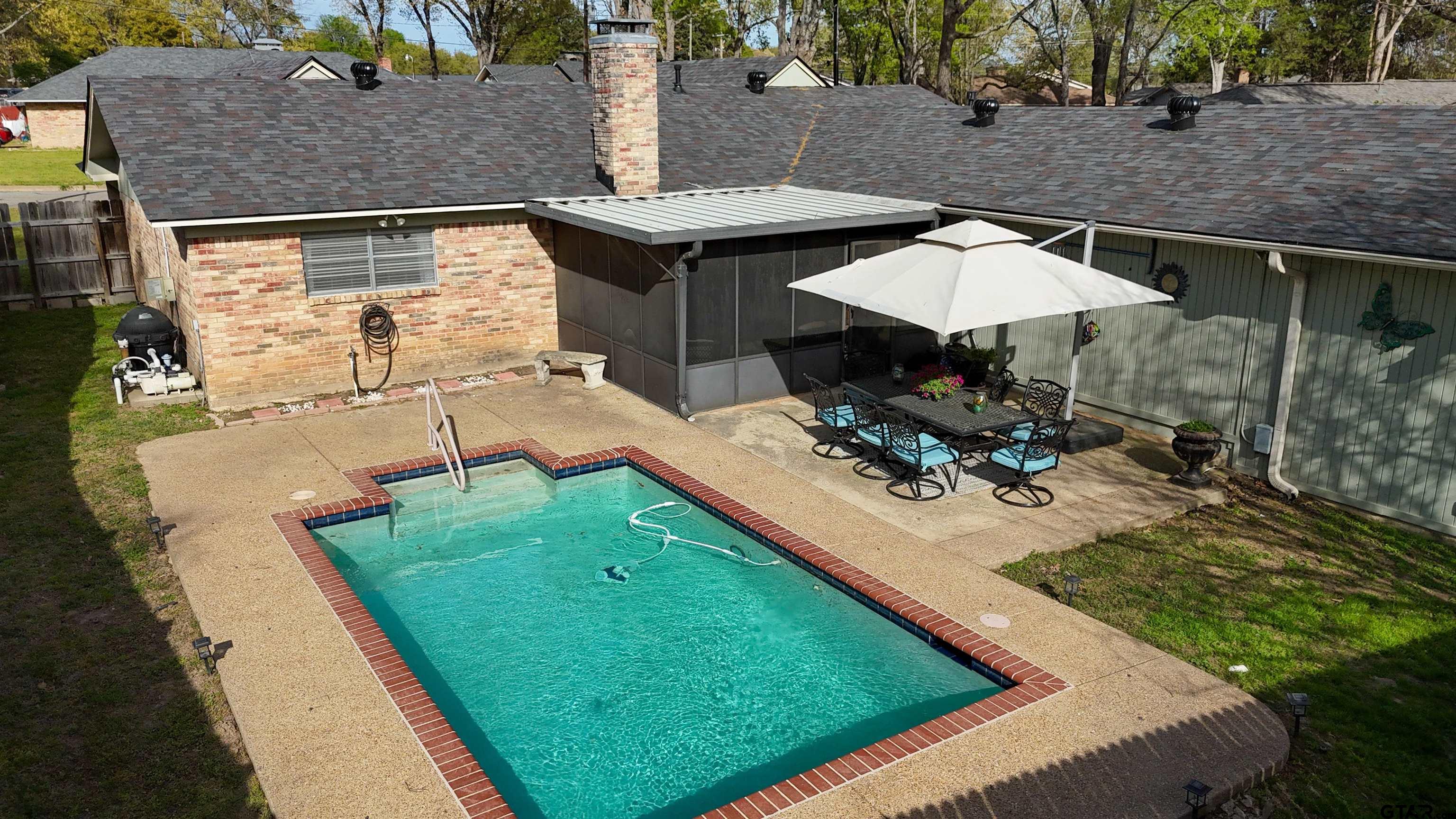 727 Oxford Drive Tyler, TX 75703 - Photo 26 of 33 a view of a backyard with sitting area