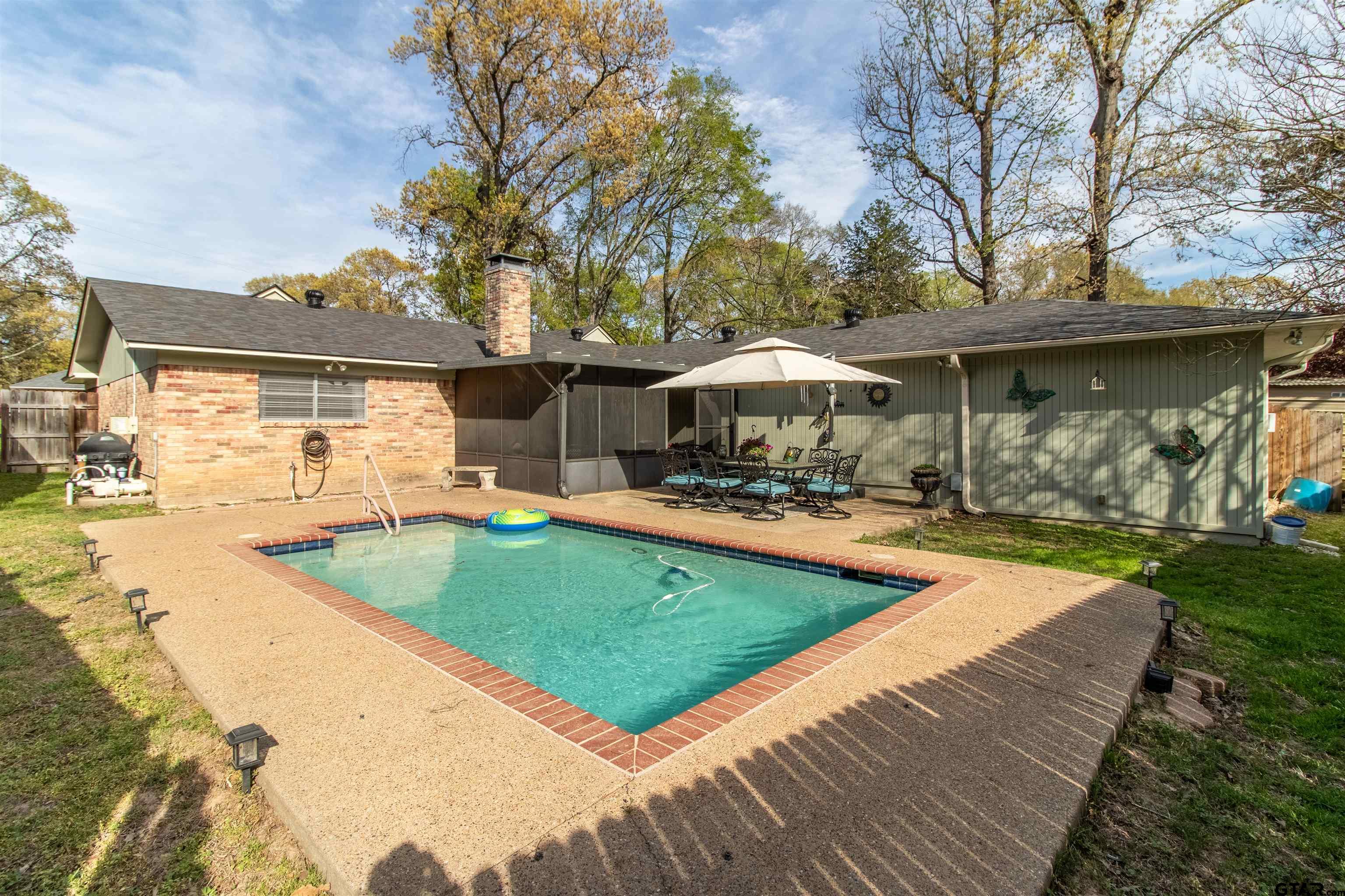 727 Oxford Drive Tyler, TX 75703 - Photo 29 of 33 a view of a swimming pool with a patio