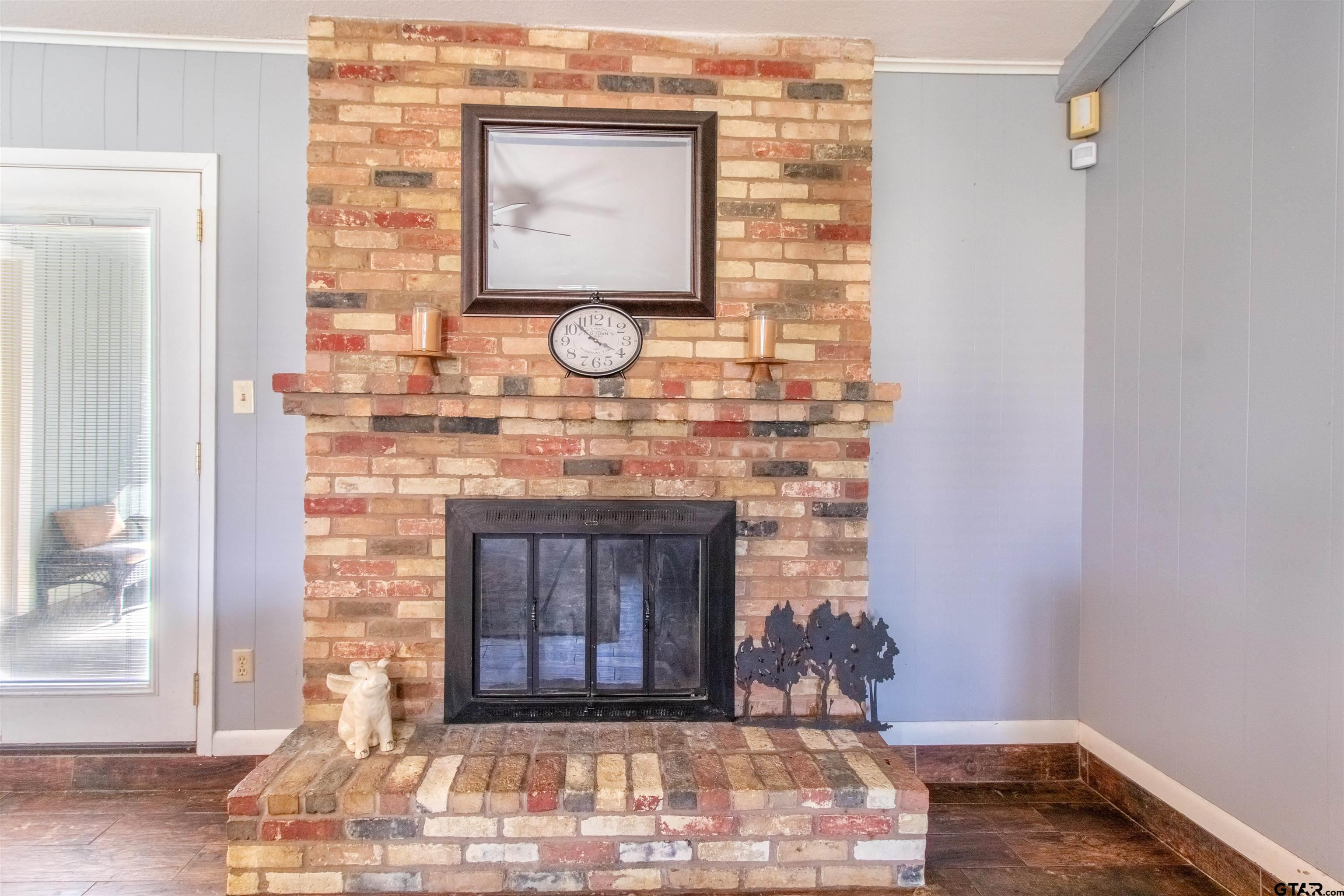 727 Oxford Drive Tyler, TX 75703 - Photo 7 of 33 a front view of a fireplace with wooden floor