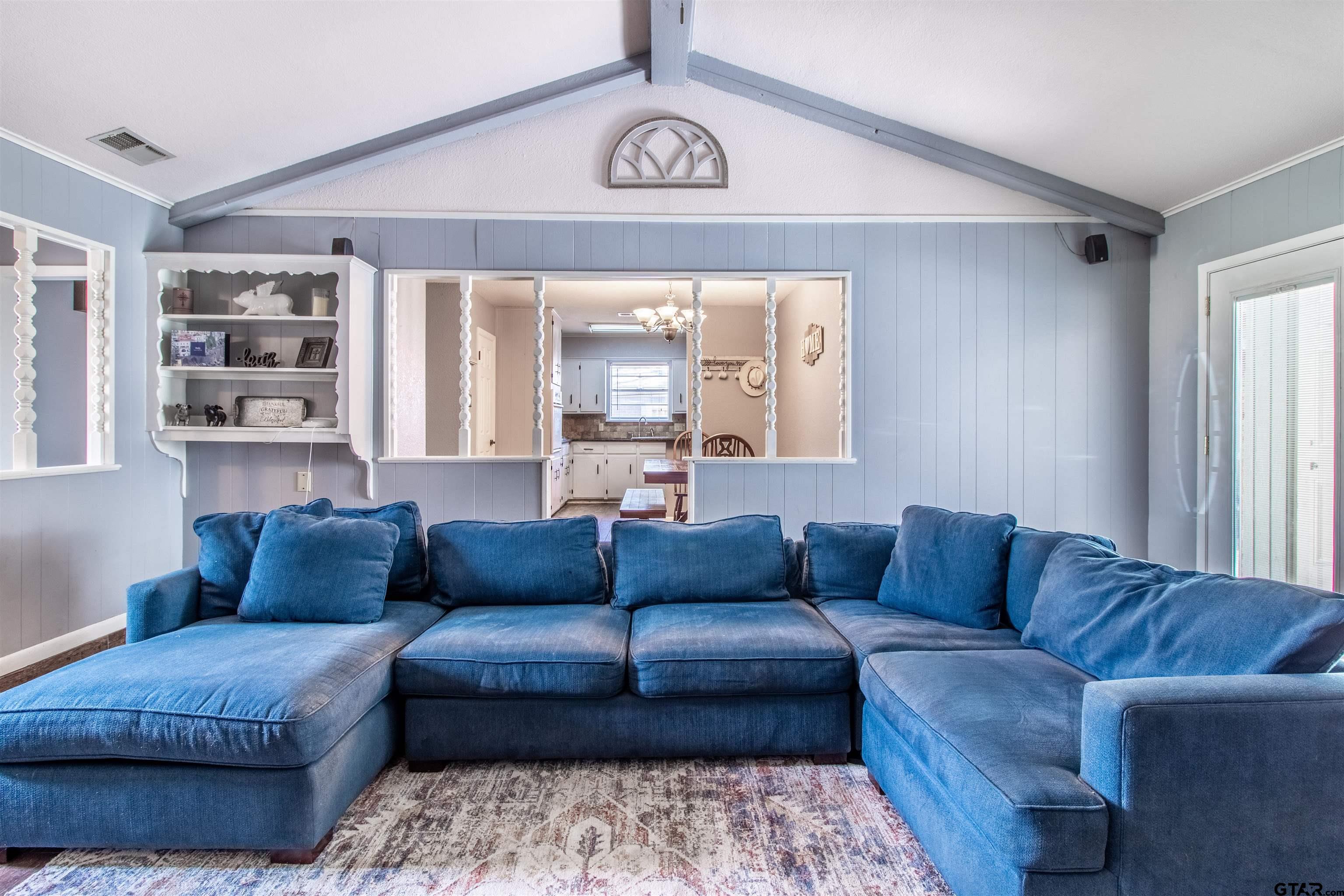 727 Oxford Drive Tyler, TX 75703 - Photo 8 of 33 a living room with furniture and a large window