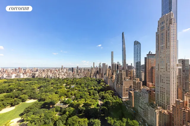 a spacious bedroom with a bed and wooden floor