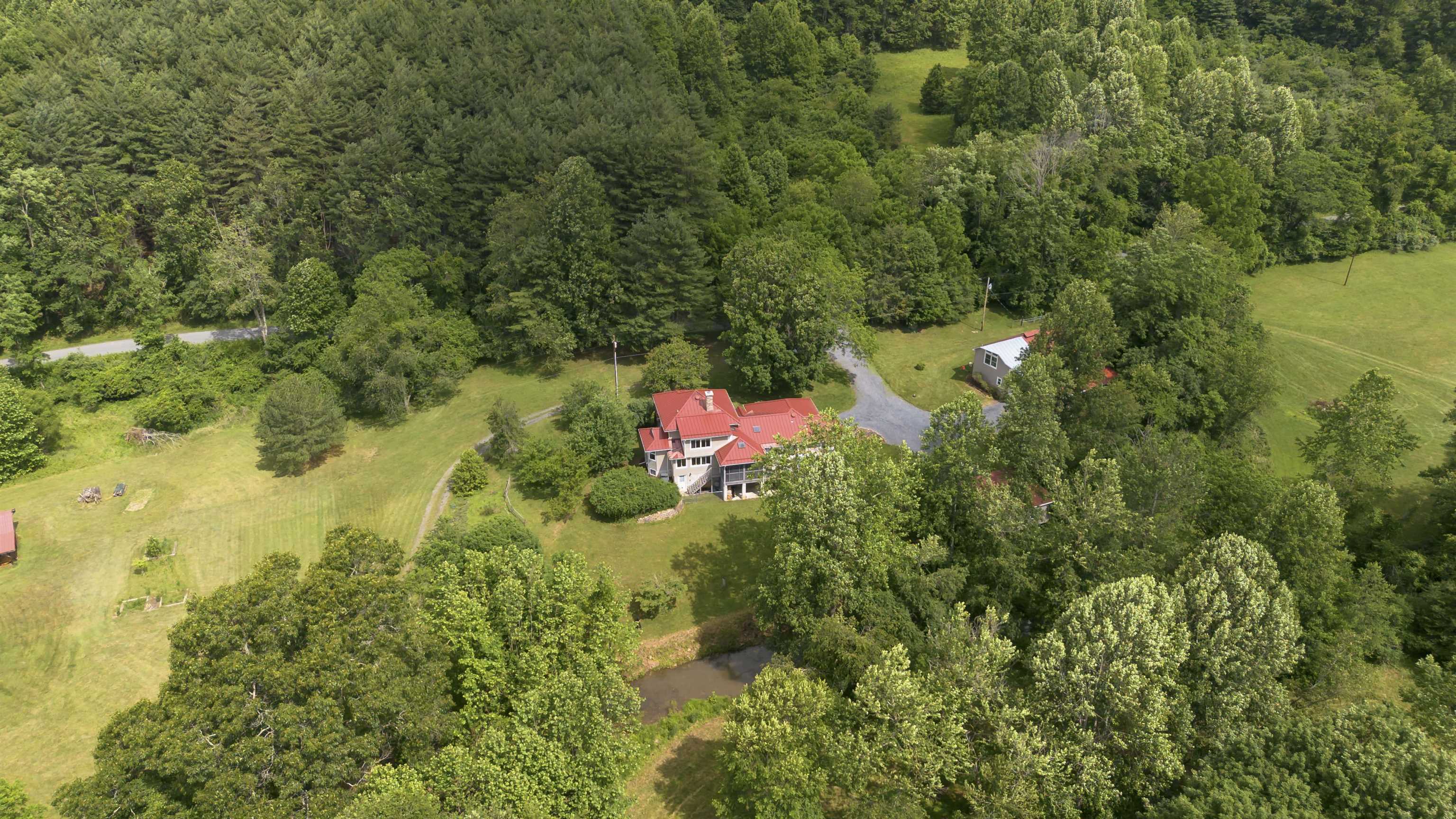 7304 Dry Run Road Williamsville, VA 24487 - Photo 3 of 57 an aerial view of residential house with outdoor space and trees all around
