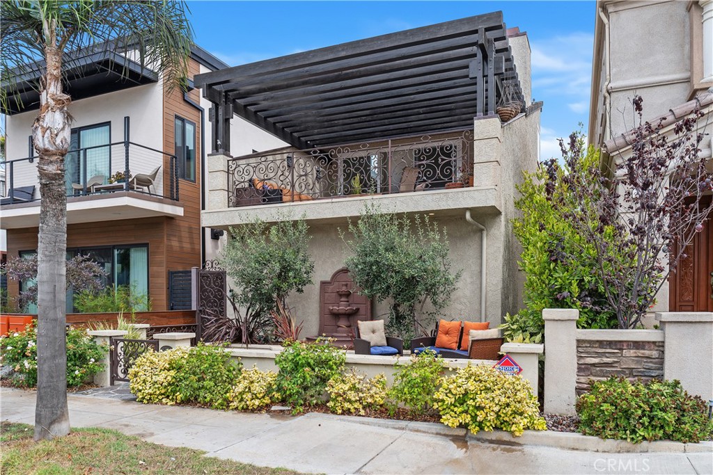 154 12th Street Seal Beach, CA 90740 - Photo 1 of 39 front view of a building with potted plants