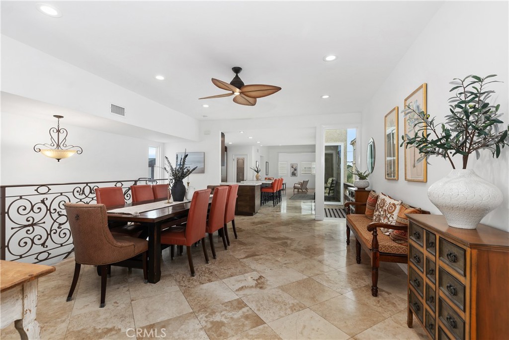 154 12th Street Seal Beach, CA 90740 - Photo 15 of 39 a view of dining room and livingroom with furniture a rug a rug and a chandelier
