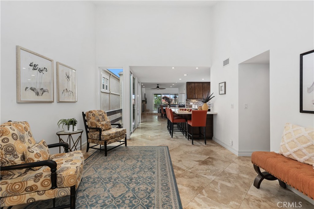 154 12th Street Seal Beach, CA 90740 - Photo 22 of 39 a living room with furniture and a chair